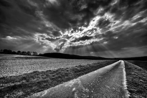 Bike path R1 with a dramatic cloudy sky, near Wesertal, Weser Uplands, Weserbergland, Hesse,