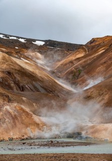 Steaming streams between colourful rhyolite mountains, Hveradalir geothermal area, Kerlingarfjöll,
