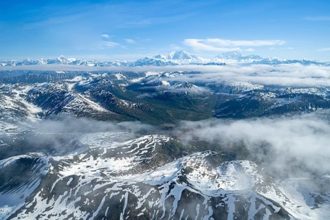 Clouds over high mountains, Mt Foraker and Mt Denali or Mount McKinley, aerial view, Alaska Range,