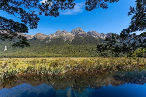 Landscape in New Zealand with mountains and lake. Mirror Lakes and Earl Mountains, Fiordland