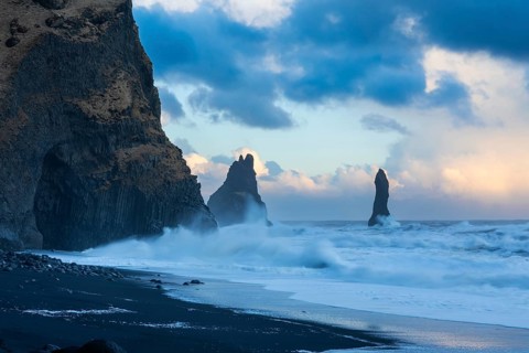 Reynisdrangar pinnacles, lava sandy beach, lava rocks, sea, waves, surf, sunset, Vik, Iceland,