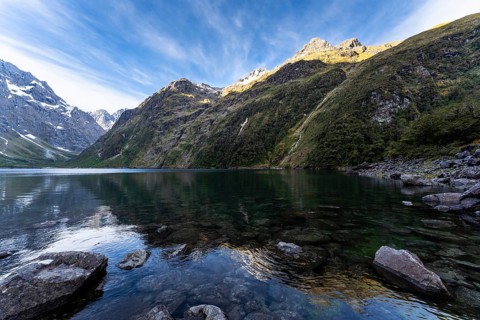 Landscape in New Zealand with mountains and lake. Lake Marian in the evening, Fiordland National