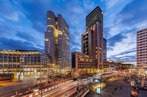Zoofenster Berlin in the evening. Skyscrapers of the Hotel Waldorf Astoria and Upper West with the