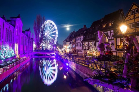 Colourfully illuminated and Christmassy decorated half-timbered houses, old town, blue hour,