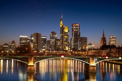 The lights of Frankfurt's banking skyline glow in the evening, Frankfurt am Main, Hesse, Germany