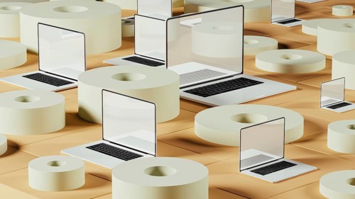 Laptops rest on a backdrop of circular tiles and geometrical forms, creating a dynamic
