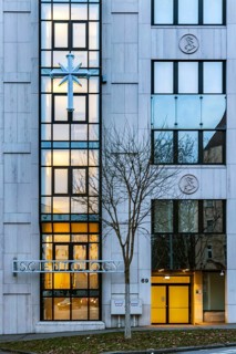 Scientology, headquarters of the sect, exterior view in the evening with Scientology cross.