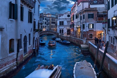 Residential buildings on the canal with water taxis, Venice, Veneto, Italy