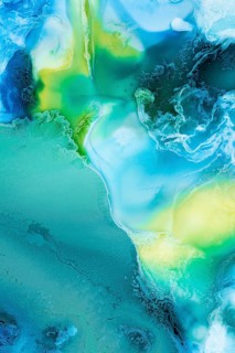 Mesmerizing flow of liquid abstract inks in vibrant blue, green, and yellow colors, creating an