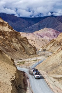 Indian lorry cistern fuel tanker trucks on NH-1 (Srinagar Leh national highway) in Himalayas.