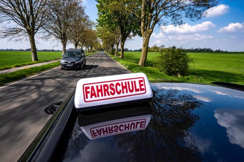 Symbolic picture driving school driving on a country road