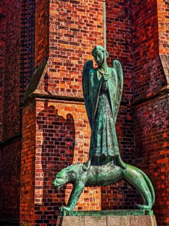 Bronze sculpture The Spiritual Warrior by the sculptor Ernst Barlach (1870 - 1938) in front of St