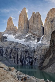 Majestic rocky peaks above a turquoise-coloured mountain lake, The rock towers of Torres del Paine