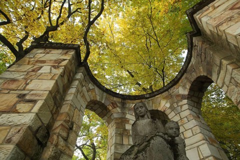 War memorial in the cemetery, autumn colors, roundel, looking up, archway, stone sculpture,