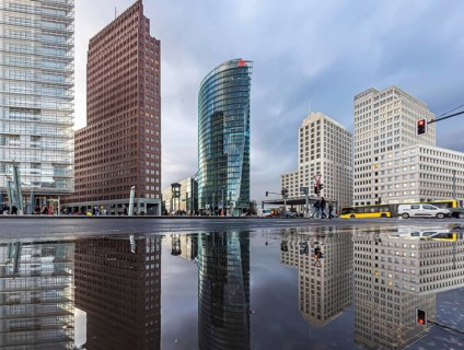 Potsdamer Platz Berlin in the evening with traffic on the streets. When it rains, the skyscrapers
