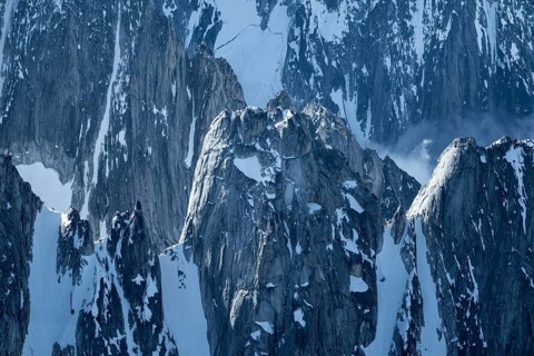 Snow and ice, epic mountains with steep cliffs, aerial view, Alaska Range, Denali National Park,