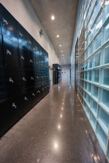 Modern corridor with black cloakrooms and glass wall, minimalistically lit, Kunsthaus Bregenz,