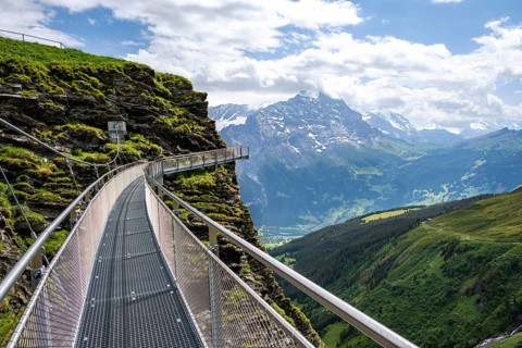 Tourist attraction First Cliff Walk, metal trail on a rocky outcrop, Grindelwald First, in front of