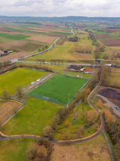 Rural aerial view with football pitch and surrounding fields and roads, Großbottwar, Ludwigsburg