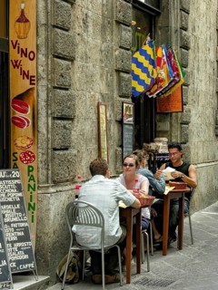 Il Palio di Siena, historical horse race, alley with small trattoria, alleyway restaurant, flags of