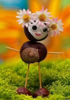 Chestnut figure with blossom headdress in the studio, North Rhine-Westphalia, Germany