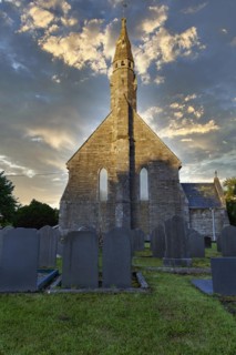 All Saints Church, gravestones in the churchyard, cemetery, evening sky, Llangorwen, Aberystwyth,