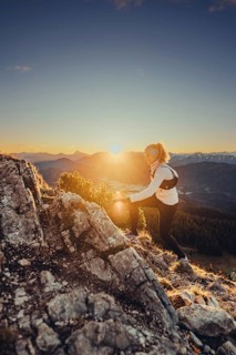 Trail running in autumn on the Jochberg on Lake Walchensee against the wonderful backdrop of the