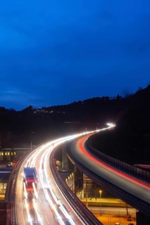 Federal road B14 in the evening, road bridge with traffic and light traces. Long exposure.