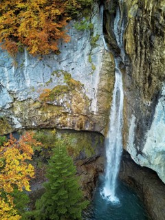 Aerial view of Berglistüber waterfall in autumn-colored surroundings, Linthal, Klausenpass, Canton