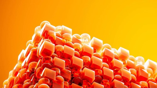 An engaging array of 3D geometric shapes in fiery orange tones combines spheres and cubes, creating