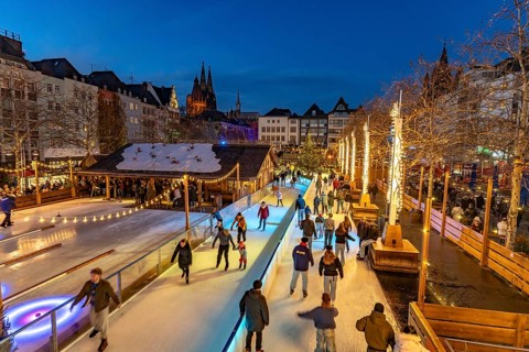 Christmas market Heinzel's winter fairy tale with the ice rink at Heumarkt at dusk, Cologne, North