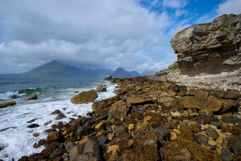 Rugged coastal landscape with dramatic waves, rocks and a cloudy sky, Elgol Beach, Elgol, Isle of