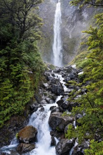The Devils Punchbowl waterfall falls down a rock face. Arthurs Pass National Park, Canterbury South