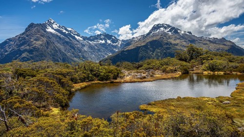 Mountain landscape with lake on the Key Summit Track hiking trail. View of Mount Christina, Mount