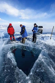 Hole in ice for scuba divers, Lake Baikal, Pribaikalsky National Park, Irkutsk Province, Siberia,