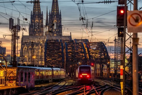 Rail track in front of Cologne Central Station, Hohenzollern Bridge across the Rhine, regional