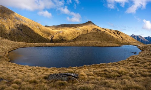 Mountain landscape with lake. Mount Burns, Borland Road Area, Fiordland National Park, Southland