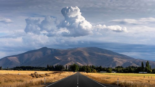 Landscape with road and mountains. View of Benmore Range. Twizel, Canterbury, South Island, New