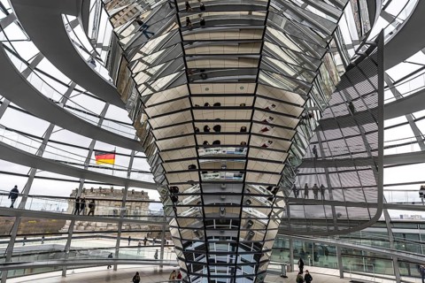 Reichstag building Berlin. Seat of the German Bundestag. Visitors in the dome on the roof of the