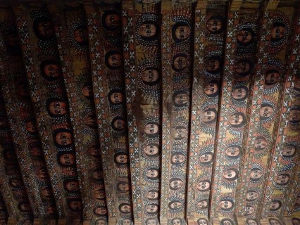 Richly decorated wooden ceiling with recurring religious symbols, Debre Birhan Selassie Church,