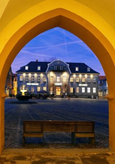 View from the open hall of the late Gothic town hall in Goslar in the evening onto the market