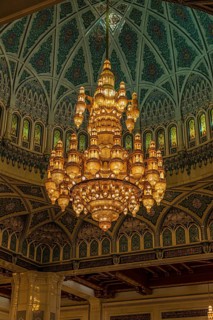Dome and illuminated chandelier in the Sultan Qaboos Mosque, Muscat, Arabian Peninsula, Sultanate