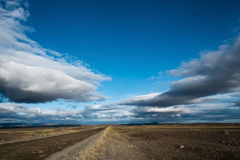 Iceland, Europe, Northern Europe, Scandinavia, lonely road, dirt road, low-hanging clouds, blue