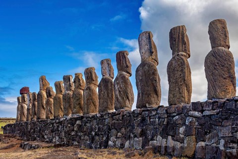 Row of Moai statues on Easter Island, set up at an angle, The Moai statues on Easter Island in the