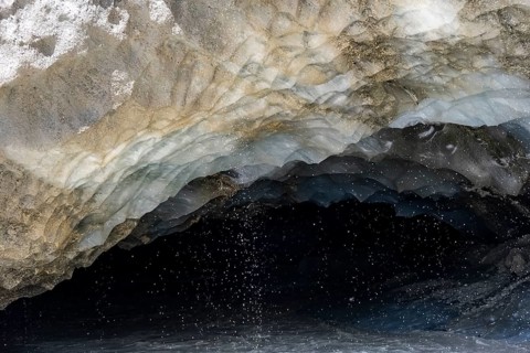 Meltwater at a glacier cave, underground glacier stream, Castner Glacier, Delta Range, Alaska