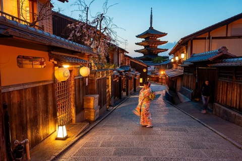 Japanese woman in kimono in an alley, Yasaka dori historic alleyway in the old town with