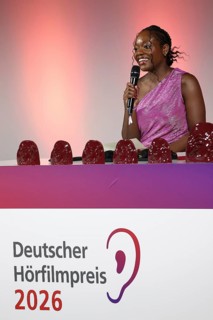 Kathy Etoa gives the laudatory speech for the documentary category at the German Audio Film Awards