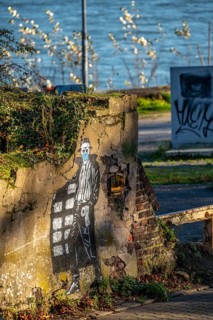 Mural on the theme of toilet paper hoarding, during the Corona crisis, on an old harbour building,
