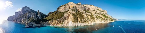 Panorama, picturesque rocky coast, cliffs with L'Aguglia pinnacle, blue sea and Cala Goloritzé