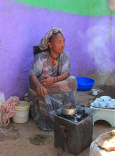 In the highlands of Abyssinia, in the village of Sina, young woman roasting coffee for the coffee